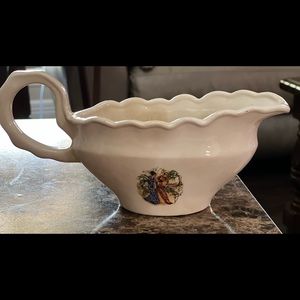 Beautiful vintage gravy or soup bowl with Asian scenes on each side.